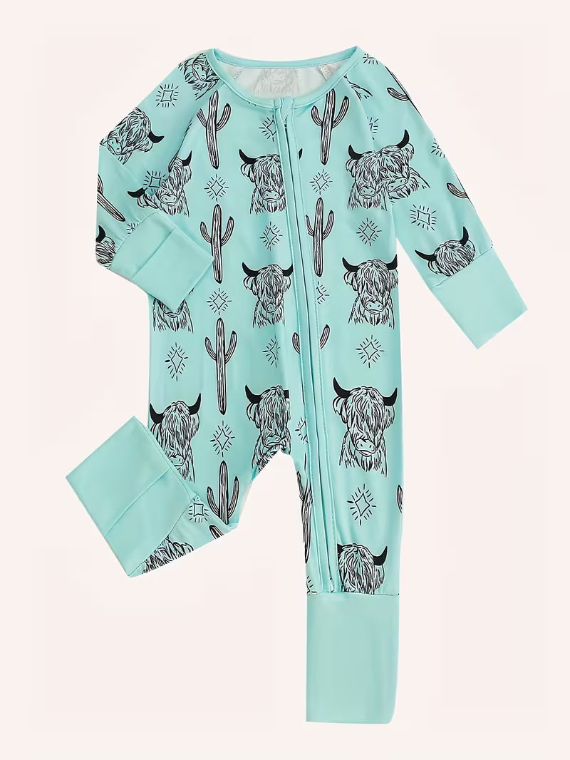 Light blue baby onesie with black animal pattern on a white background